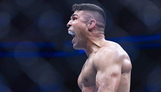 Vicente Luque of Brazil reacts after winning his middleweight bout against Kelvin Gastelum of the United States at UFC 327 at the Kaseya Center on Saturday, April 11, 2026, in downtown Miami, Fla.