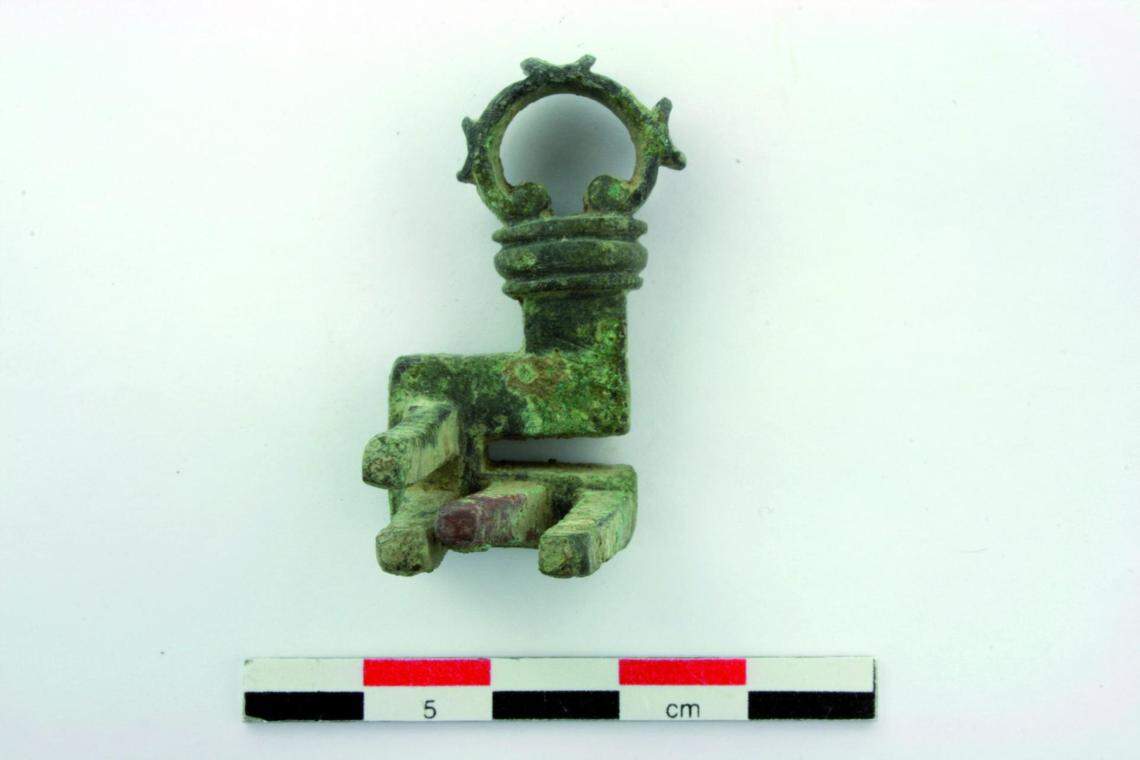 A copper alloy key unearthed from the ruins.