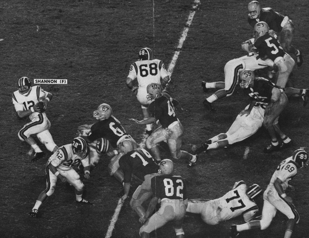 The Gators and the Canes on the field during a rivalry game.