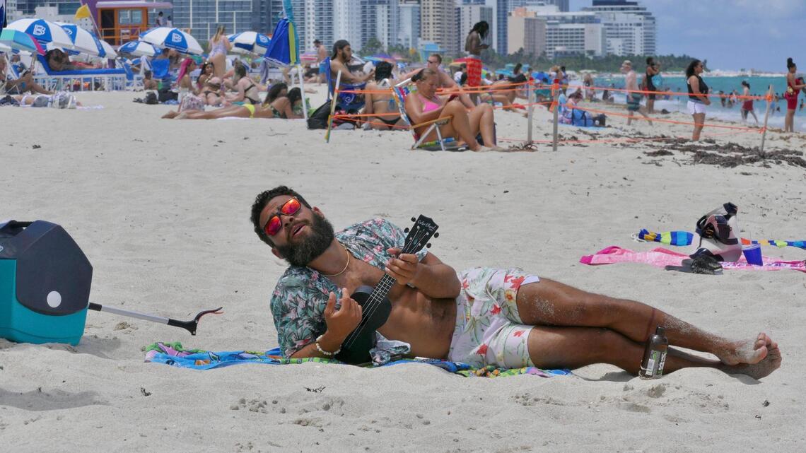‘Getting back to normal.’ Big crowds, few masks on South Beach on first reopened weekend