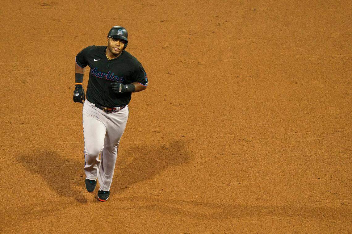 Miami Marlins’ Jesus Aguilar rounds the bases after hitting a two-run home run during the sixth inning of a baseball game against the Philadelphia Phillies, Friday, July 24, 2020, in Philadelphia.