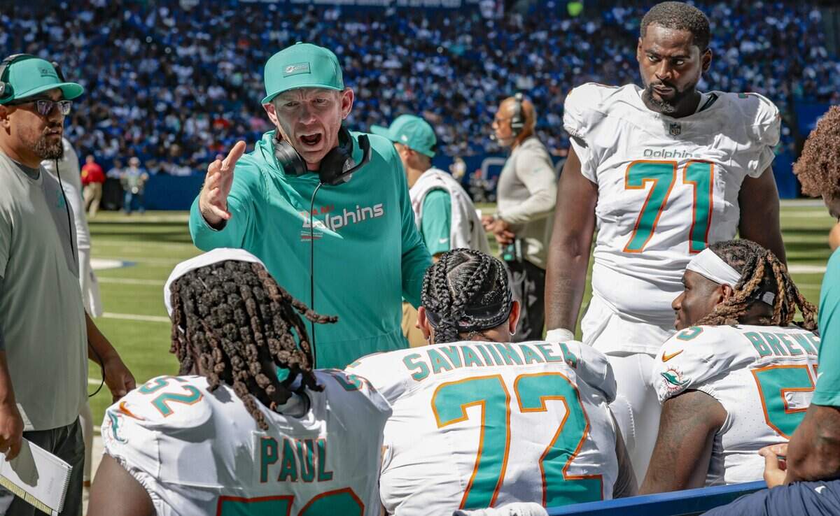 Miami Dolphins offensive line coach Butch Barry speaks to offensive line players on the bench during the game against the Indianapolis Colts in the second half of an NFL game at Lucas Oil Stadium in Indianapolis on Sunday, September 7, 2025.