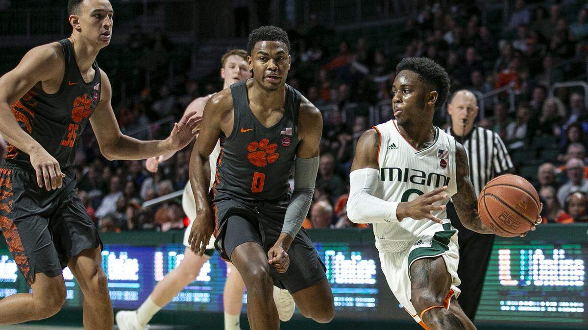 Miami Hurricanes guard Chris Lykes (0) looks to pass from under the basket in the first half as the Miami Hurricanes beat the Clemson Tigers in Coral Gables on Wednesday, February 13, 2019.