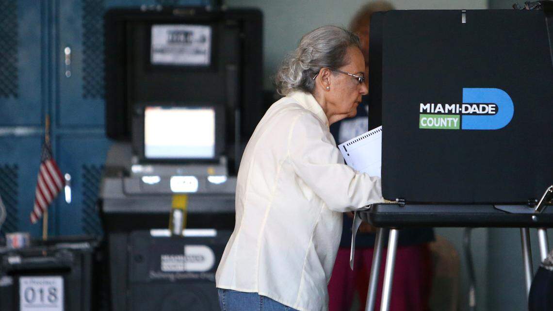 A woman fills out her ballot during the 2016 General Election at Miami Beach Fire Station #4 on Tuesday, November 8, 2016.