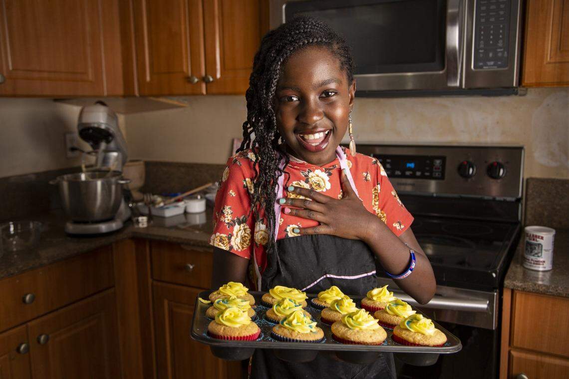 Delphine Nephtalie Dauphin, 10, shows her cupcakes in her home kitchen on Saturday, July 20, 2019. Delphine has been the owner of her own cupcake business, Joy’s Yummy Cupcakes, for three years. She’s catered parties and weddings and sells hundreds of cupcakes on weekends.