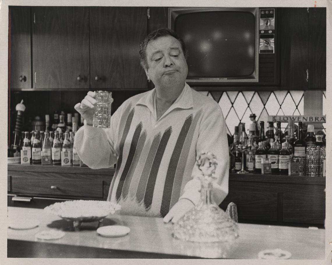 Gleason enjoys a drink at his “restaurant-sized” bar in new home