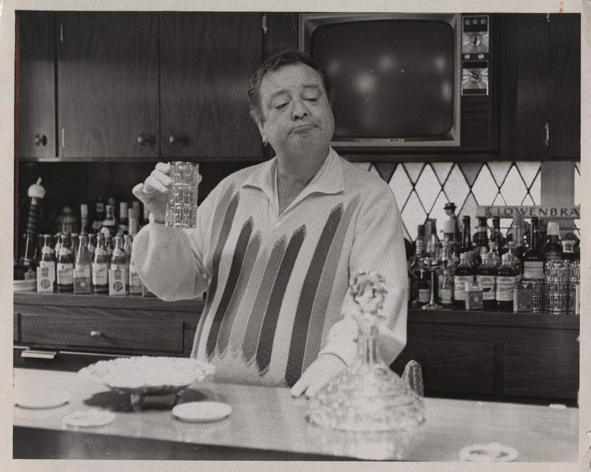 Gleason enjoys a drink at his “restaurant-sized” bar in new home