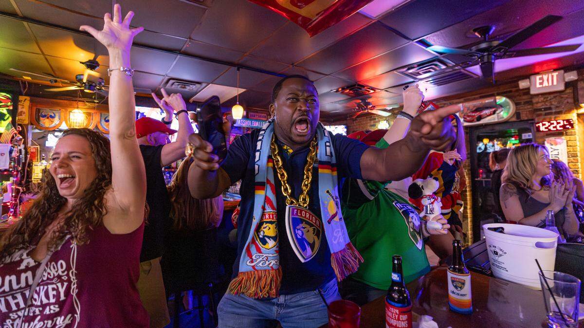 Florida Panthers fan Alexie Creary cheers after his team scored against the Edmonton Oilers to win Game 2 of the NHL Stanley Cup Final at the Inn Field Bar & Grill on Friday, June 6, 2025, in Sunrise, Fla.