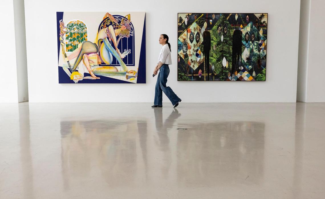 Jessica Stanley, Christie’s public relations director walks past works by Christina Quarles, left, and Rashid Johnson that were at the de la Cruz Collection. After Rosa de Cruz’s death in February 2024, Christie’s began selling works from the de la Cruz collection in May 2024.