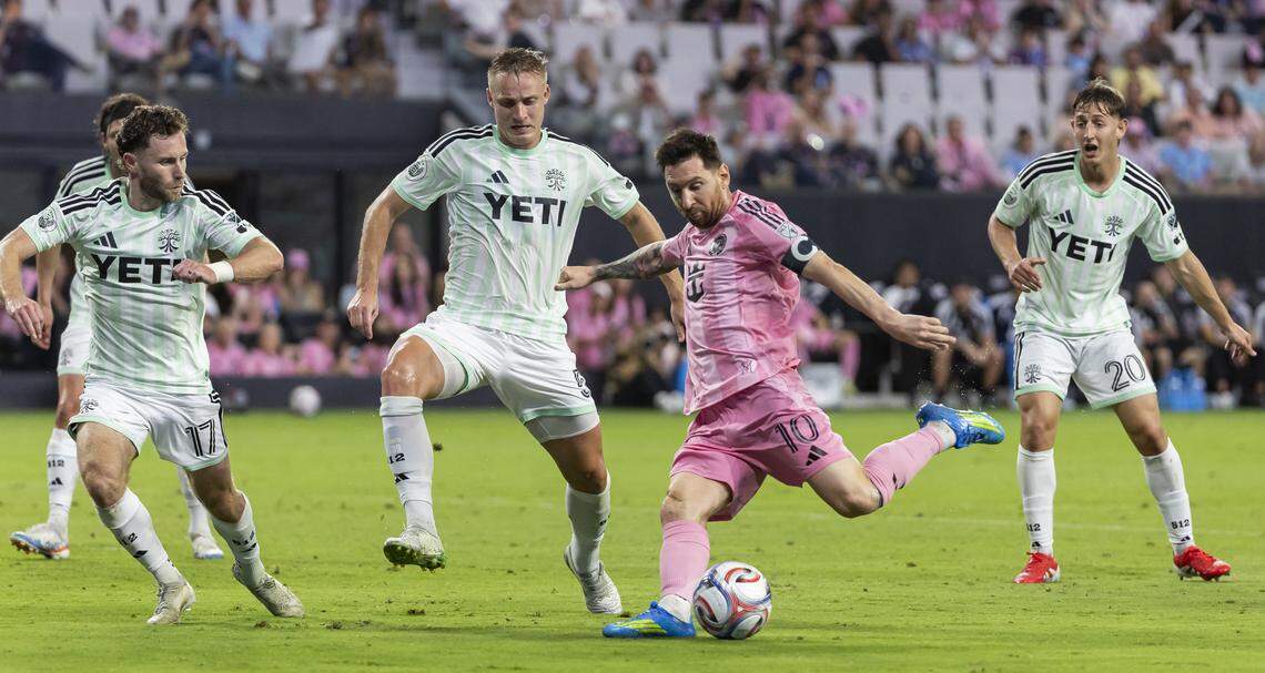 Inter Miami CF forward Lionel Messi (10) kicks the ball as Austin FC defender Jon Gallagher (17), defender Oleksandr Svatok (5) and midfielder Nicolás Dubersarsky (20) defend in the second half of their MLS match at Nu Stadium in Miami Freedom Park on Saturday, April 4, 2026, in Miami, Fla.
