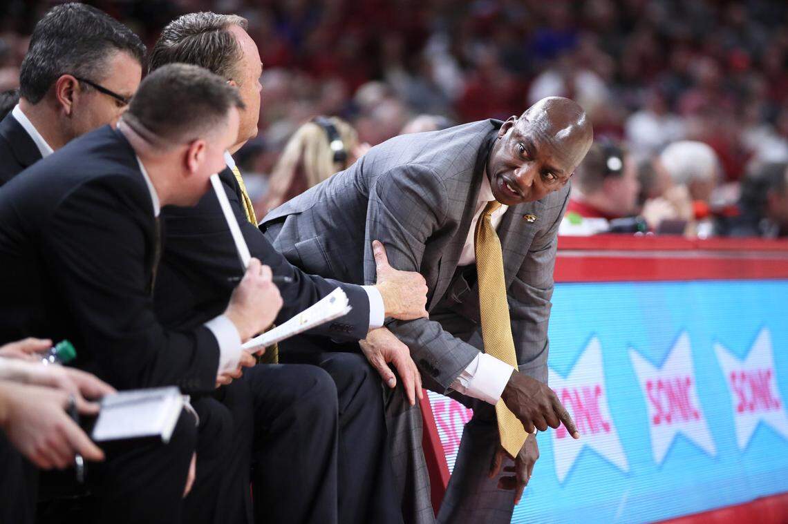 Jan 4, 2023; Fayetteville, Arkansas, USA; Missouri Tigers associate head coach Charlton ÒC.Y.Ó Young talks to other assistants during the second half against the Arkansas Razorbacks at Bud Walton Arena. Arkansas 74-68. Mandatory Credit: Nelson Chenault-USA TODAY Sports