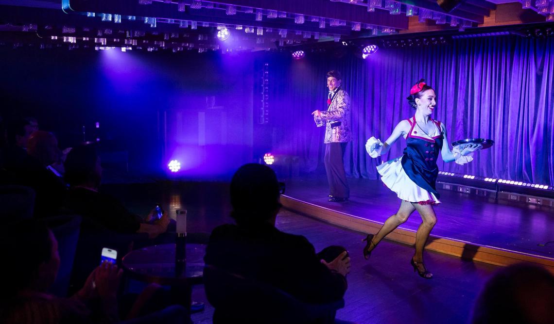 Actors Fernando Castro and Helen Villa assume the roles of Ramon Lazarus and Trixie Martini for guests attending the interactive murder mystery show ‘Noir,’ performed at the Bright Lights Society venue aboard Cunard’s Queen Anne while docked at PortMiami on Tuesday, Jan. 21, 2025, in Miami, Fla.