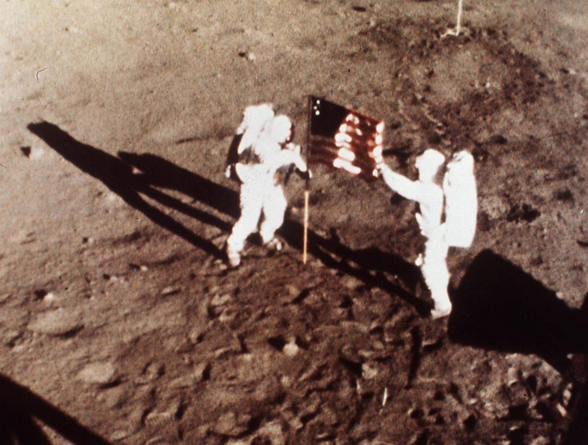 Neil Armstrong and Edwin E. “Buzz” Aldrin, the first men to land on the moon, plant the U.S. flag on the lunar surface. Armstrong commanded the Apollo 11 spacecraft that landed on the moon July 20, 1969. He radioed back to Earth the historic news of “one giant leap for mankind.” Armstrong and Aldrin spent nearly three hours walking on the moon, collecting samples, conducting experiments and taking photographs. In all, 12 Americans walked on the moon from 1969 to 1972.