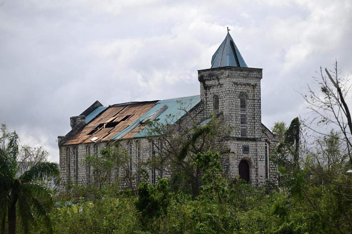 A Church with sections of its roof damage is seen damage following the passage of Hurricane Melissa, outside Santa Cruz, St Elizabeth, Jamaica on October 29, 2025. Hurricane Melissa ripped up trees and knocked out power after making landfall in Jamaica on October 28, 2025, as one of the most powerful hurricanes on record, inundating the island nation with rains that threaten flash floods and landslides.