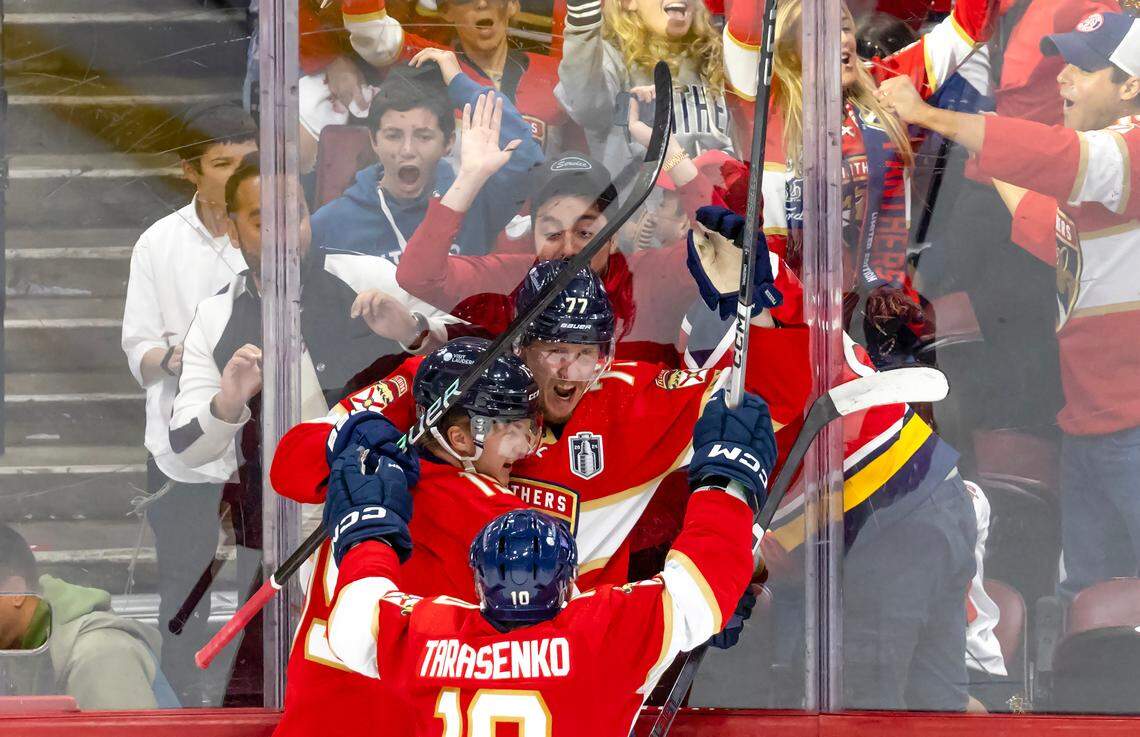 Florida Panthers defenseman Niko Mikkola (77) celebrates with teammates Vladimir Tarasenko (10) and Anton Lundell (15) after scoring a goal against Edmonton Oilers during the second period of Game 2 of the NHL Stanley Cup Final at the Amerant Bank Arena on Monday, June 10, 2024, in Sunrise, Fla.