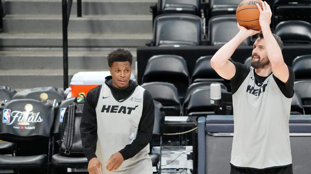 Miami Heat forward Kevin Love (42) shoots the ball as guard Kyle Lowry (7) reacts during a practice session on media day before the 2023 NBA Finals at Ball Arena.