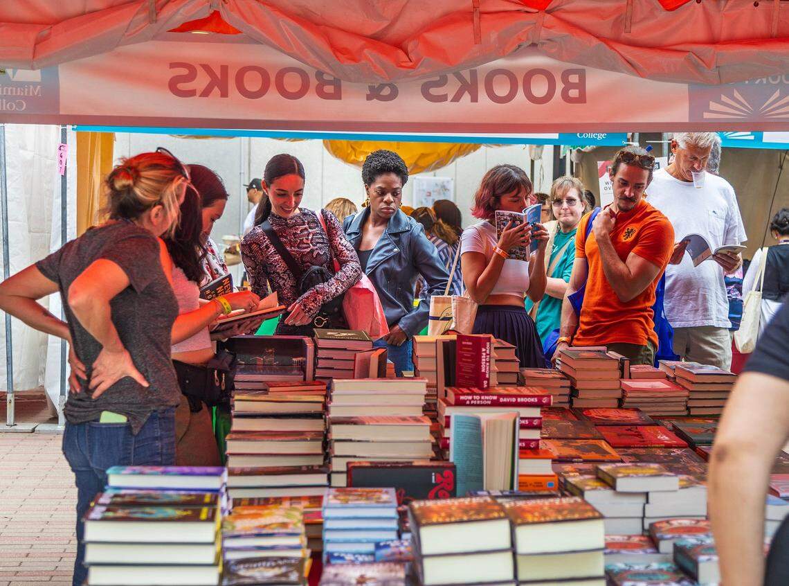 Book lovers check all different books at the Books and Books book store’s booth, during the celebration of the Miami Book Fair’s 40th Edition, the most important literary event in South Florida, on Saturday November 18, 2023.