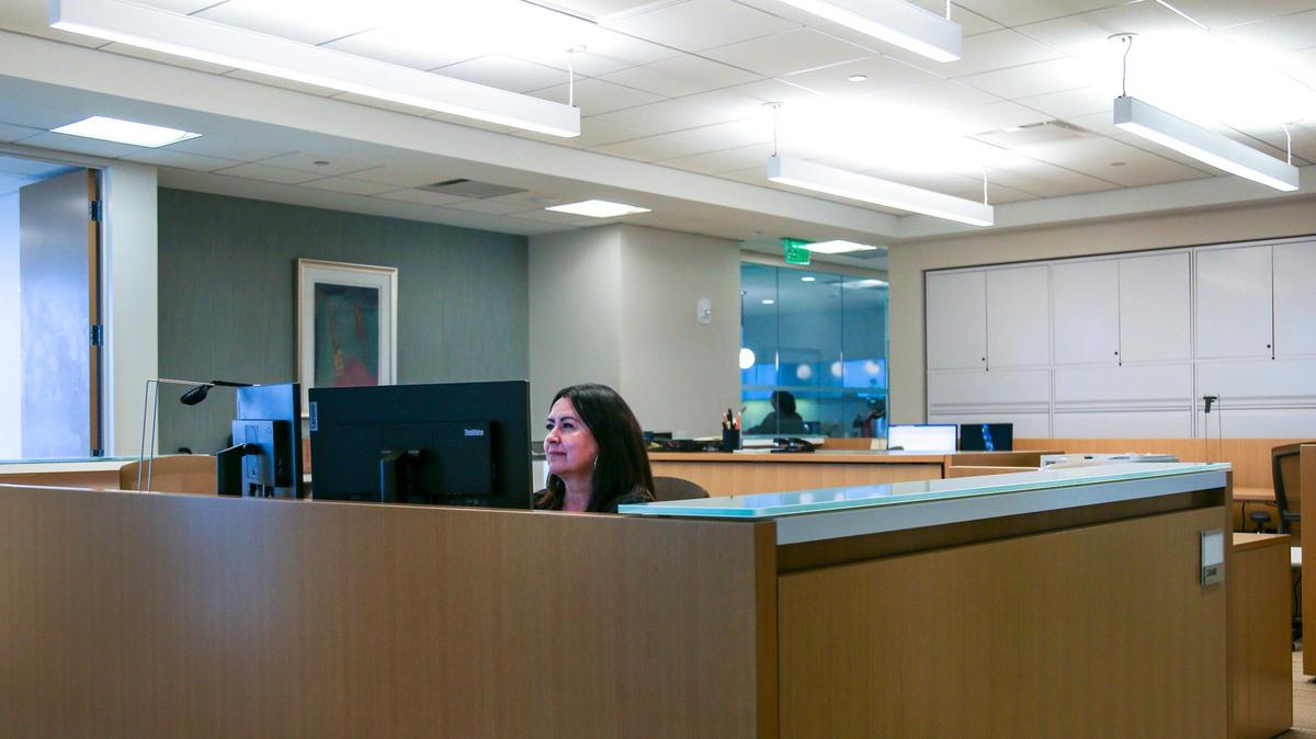 You’re not the only one working from home: So are thousands of government workers. And as a result, Uncle Sam’s office needs have changed dramatically. Above: Claire Gomez, a practice coordinator at Winston & Strawn works from her desk at the firm’s temporary office space in downtown Miami, on Friday, June 10, 2022.