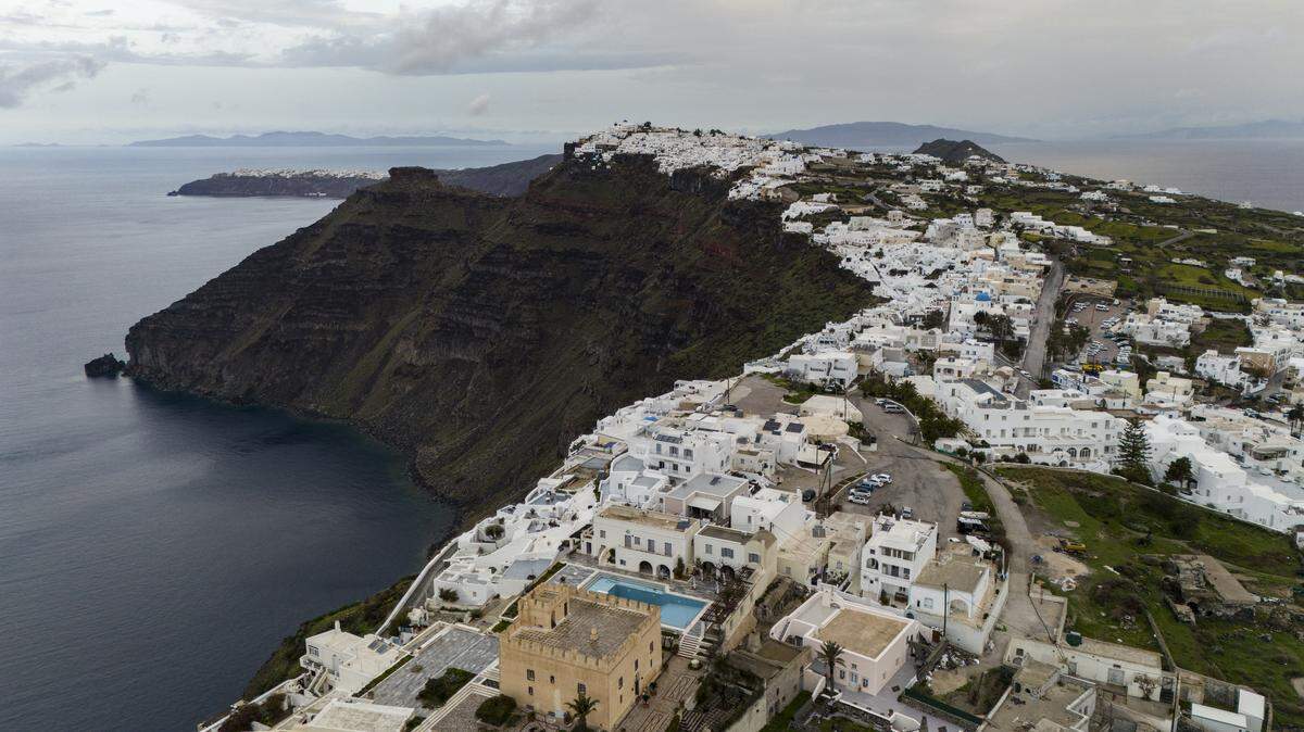 A photo shows a view of the old port and the town of Fira on the Greek Island of Santorini, in the Agean Sea, on February 4, 2025.