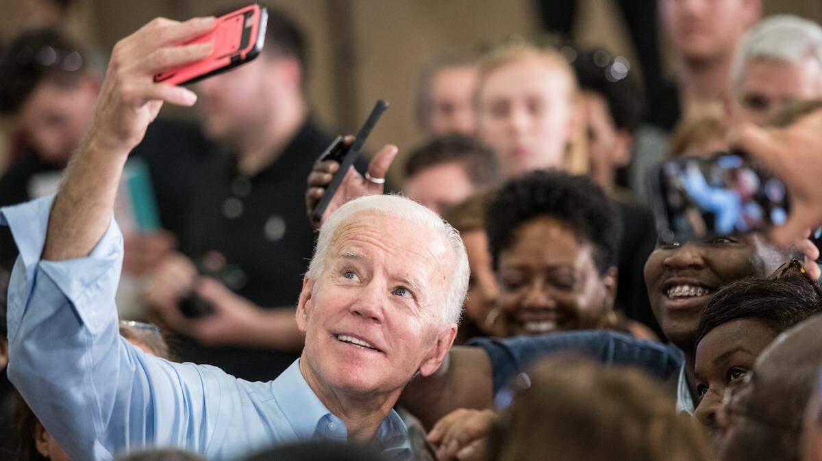 As a candidate, Joe Biden takes photos with people in the crowd at a campaign event in Columbia, South Carolina.