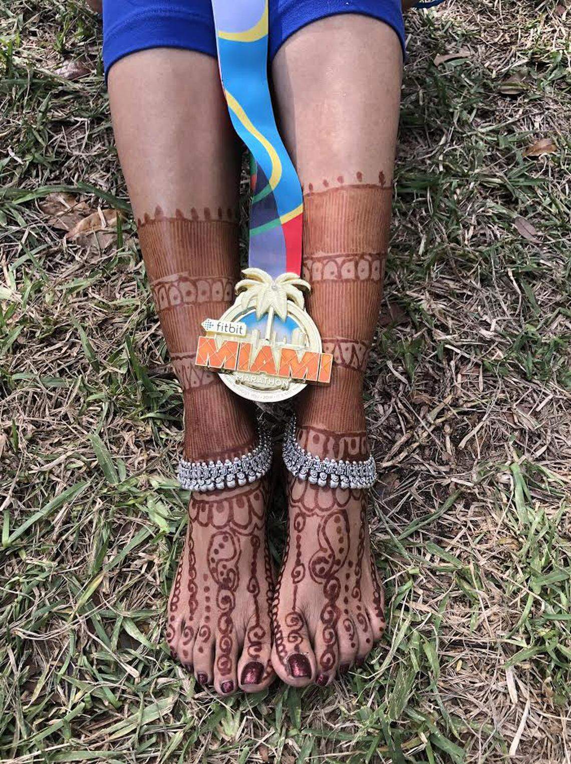 Barefoot runner Nilima Pai, who came to Weston from India in 2015, often decorates her feet with henna before marathons.