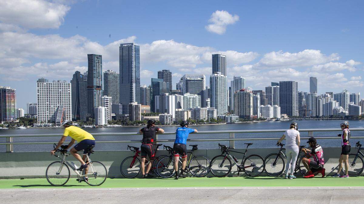Cyclists take a break along the Rickenbacker Causeway because Miami loves health.