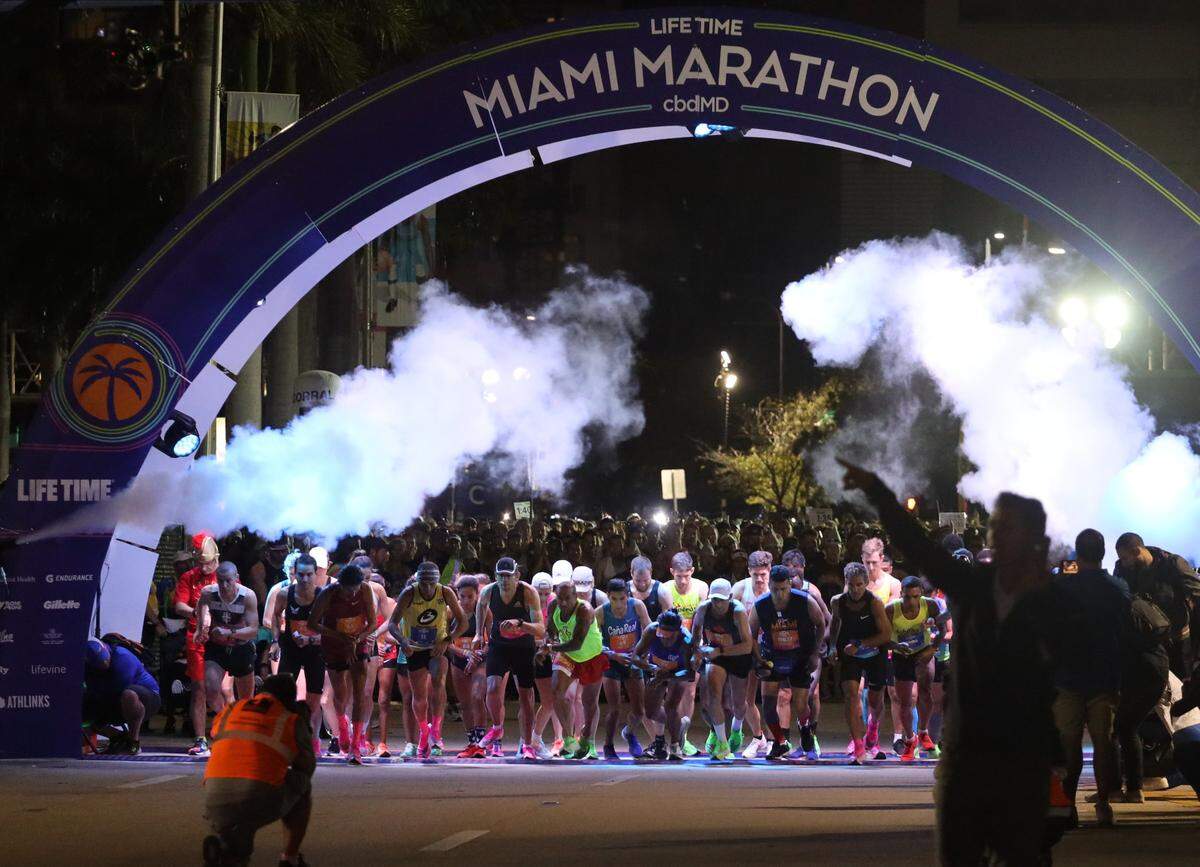 Elite runners start the 18th annual Life Time Miami Marathon and Half Marathon in the dark at 6 a.m. Sunday, February 9, 2020 in front of AmericanAirlines Arena and finished on Biscayne Boulevard near Bayfront Park. There were more than 20,000 combined runners registered for the marathon and half marathon and the second marriage proposal during the marathon.