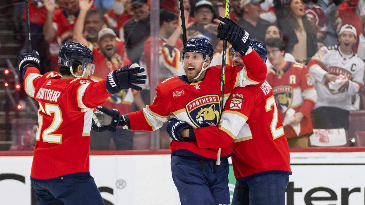 Florida Panthers center Sam Bennett (9) celebrates with his teammates after scoring a goal against the Tampa Bay Lightning in the first period in Game 2 of the first-round of the 2024 Stanley Cup Playoffs at Amerant Bank Arena on Tuesday, April 23, 2024, in Sunrise, Fla.