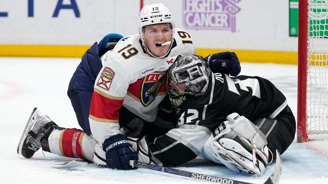 Florida Panthers left wing Matthew Tkachuk, left, falls into Los Angeles Kings goaltender Jonathan Quick during the third period of an NHL hockey game Saturday, Nov. 5, 2022, in Los Angeles. (AP Photo/Mark J. Terrill)
