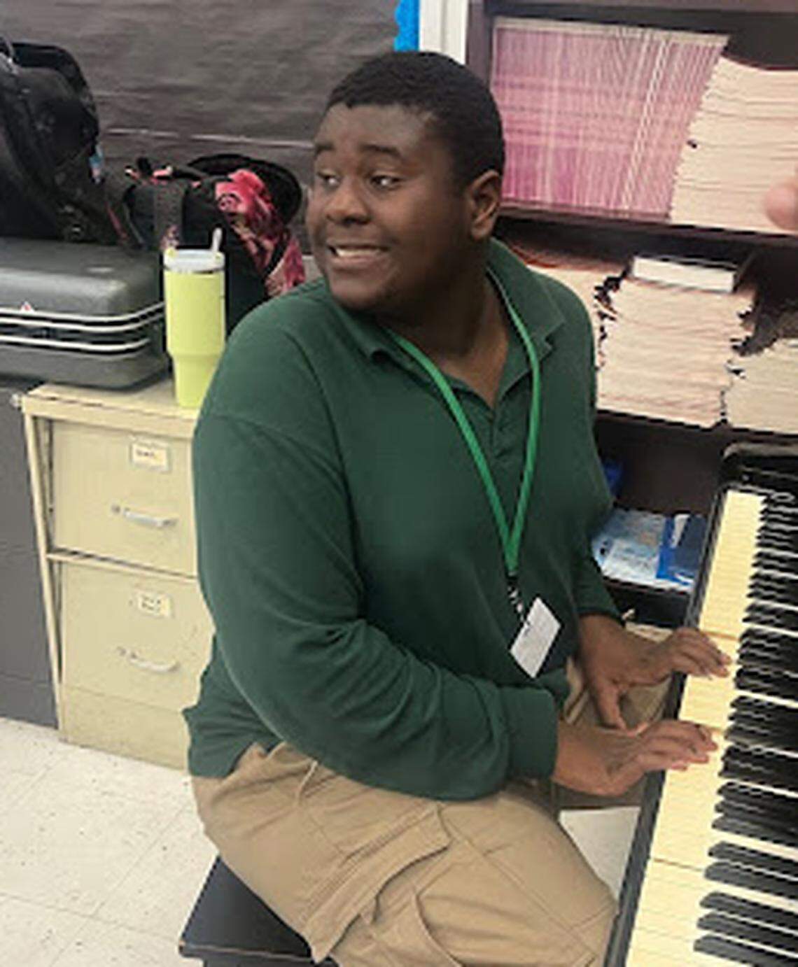Walter smiles as he looks over his shoulder toward his classmates.