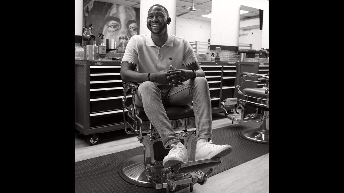 Public speaker and Florida Memorial University professor Jefferson Noel, 28, finds the barbershop Fweago Cutz a space to have intelligent and insightful conversations regarding issues facing the Black community.