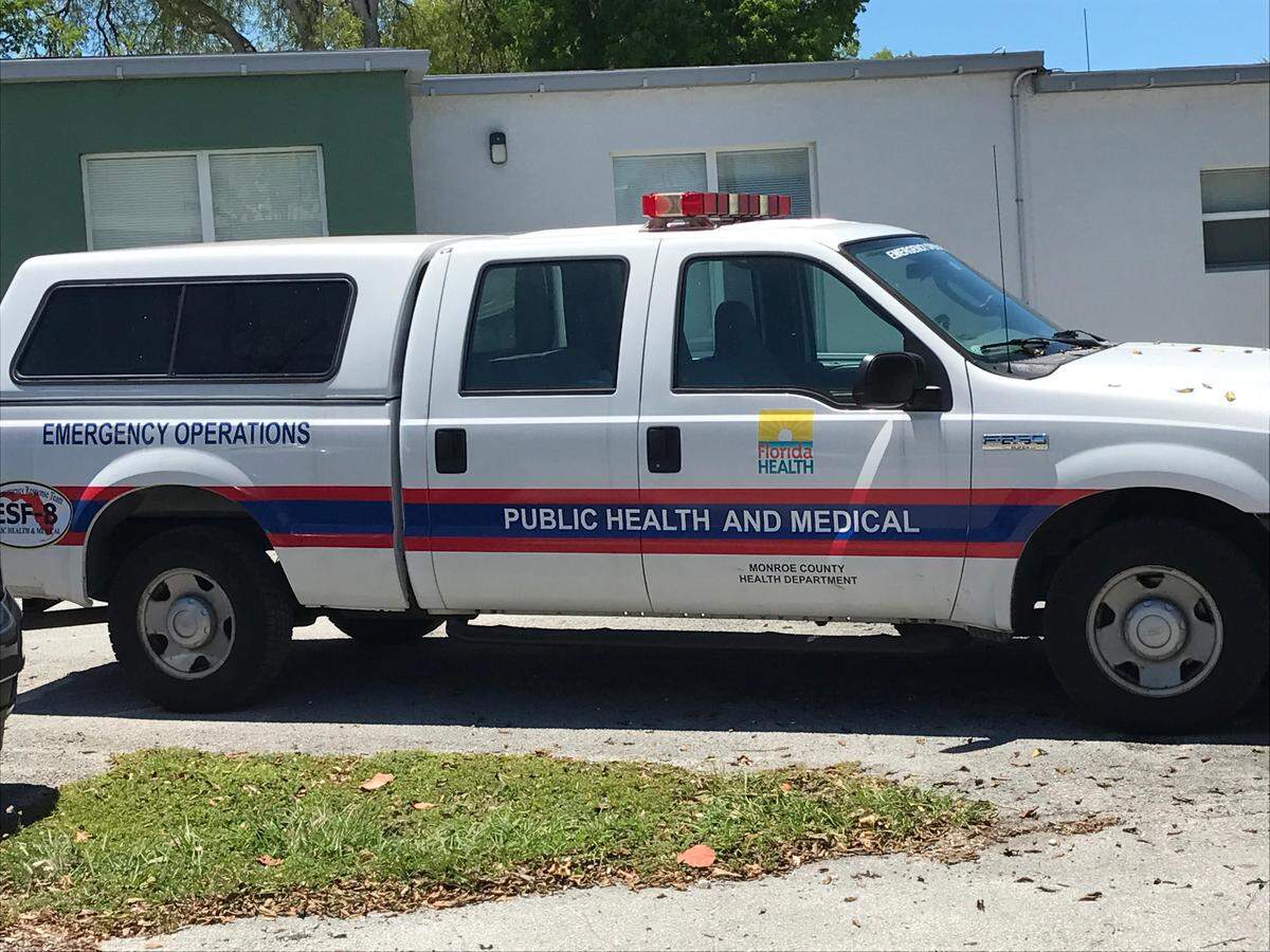 A Florida Department of Health emergency operations vehicle is parked at the parking lot for the Crystal Health and Rehab Center nursing home on Plantation Key Monday, May 4, 2020.