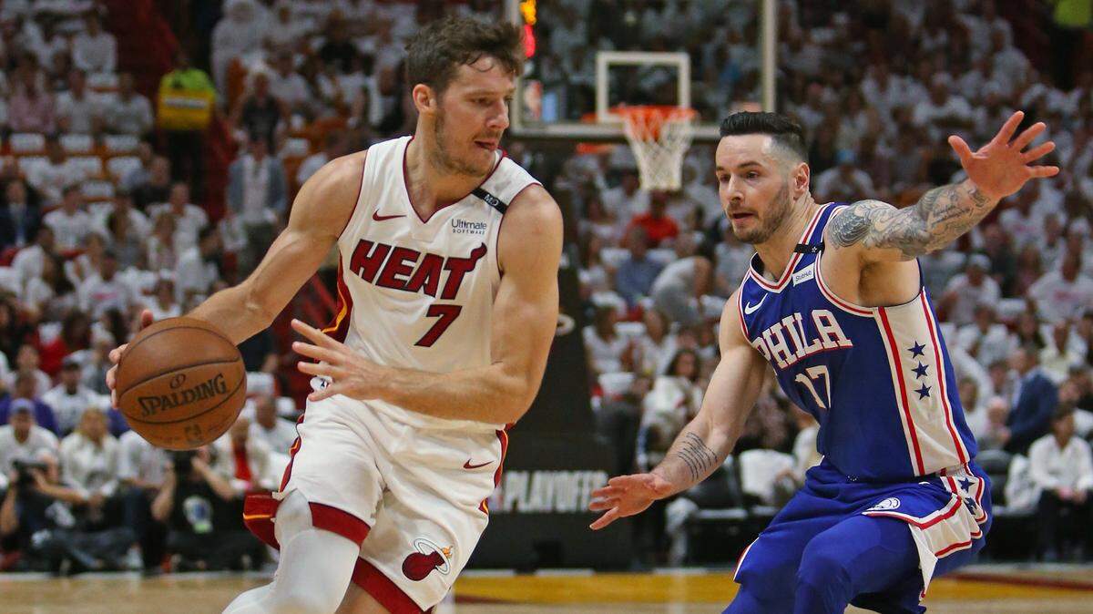 Heat guard Goran Dragic drives against Philadelphia 76ers guard JJ Redick during the first quarter of in Game 3 of their playoff series on April 19, 2018.