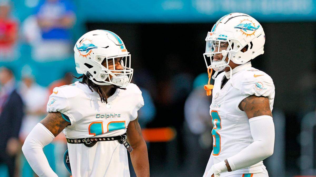 Miami Dolphins wide receiver Jaylen Waddle (17) talks with Dolphins free safety Jevon Holland (8) before the start of an NFL football game against the New York Giants at Hard Rock Stadium on Sunday, December 5, 2021 in Miami Gardens, Florida.