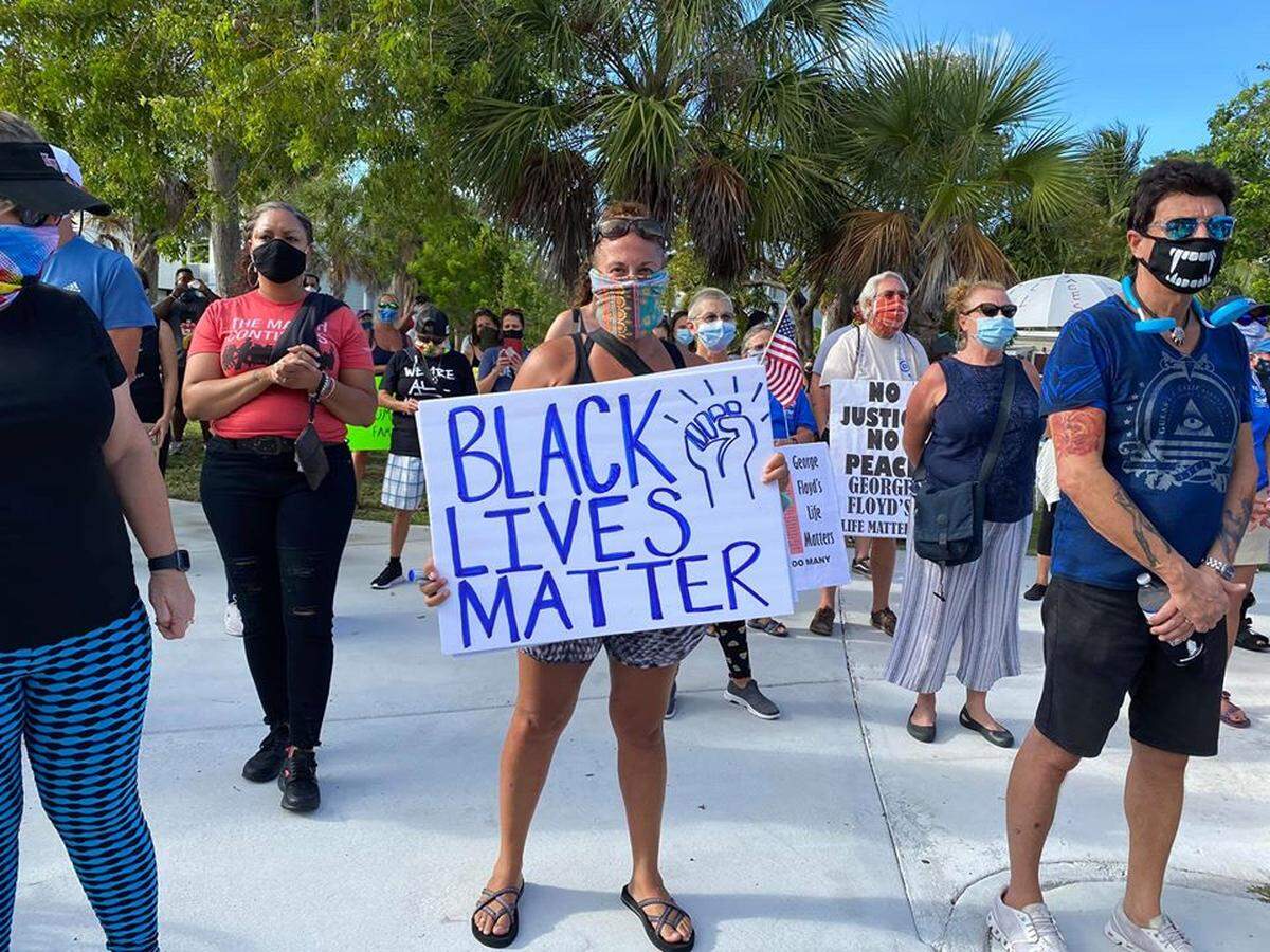 A woman in Key West on June 1, 2020, protests the death of George Floyd while in the custody of the Minneapolis police.