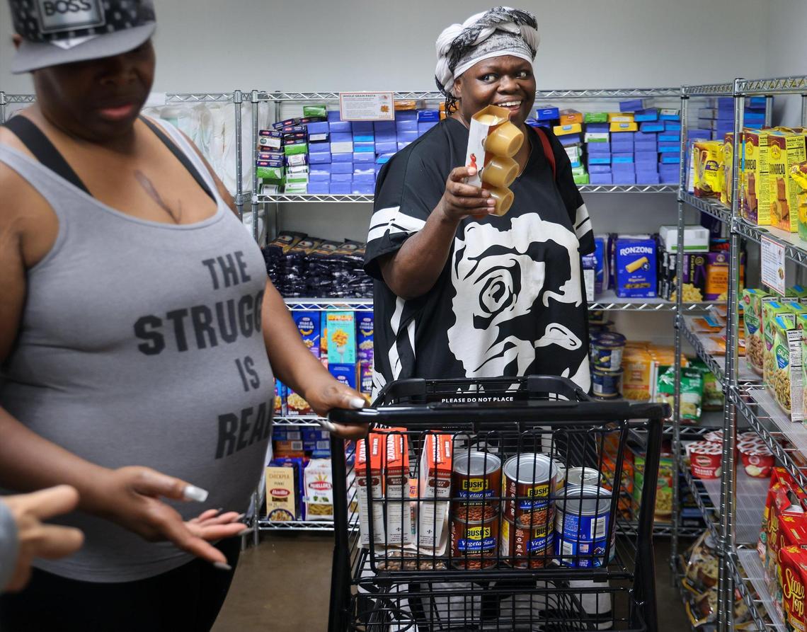 Lathoya Bennett, 49, left, and Jackie Brown, 57, right, shop for nonperishable food items at Feeding South Florida’s Pembroke Park food pantry on Wednesday, May 28, 2025.