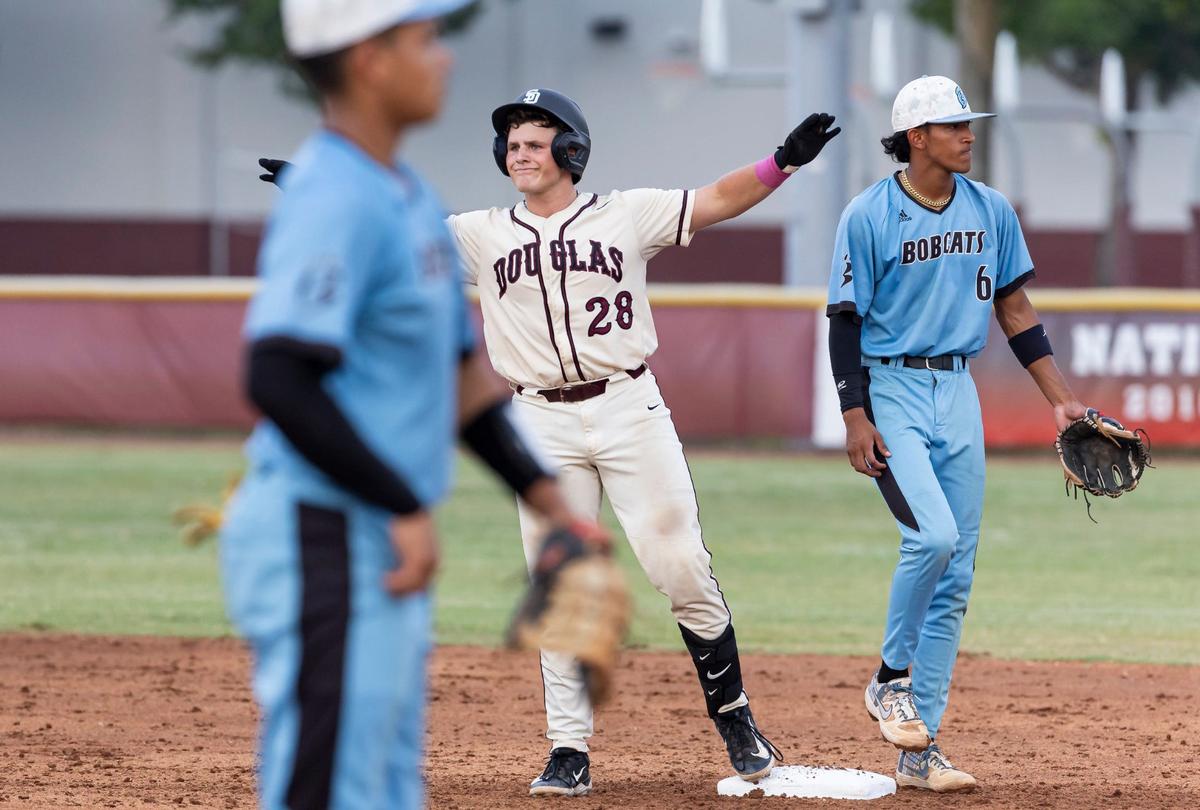 Marjory Stoneman Douglas Eagles’ Ethan Askin (28) reacts on base after hitting a double against the West Broward Bobcats in the second inning of their Region 4-7A baseball final at Anthony Rizzo Field on Monday, May 13, 2024, in Parkland, Fla.