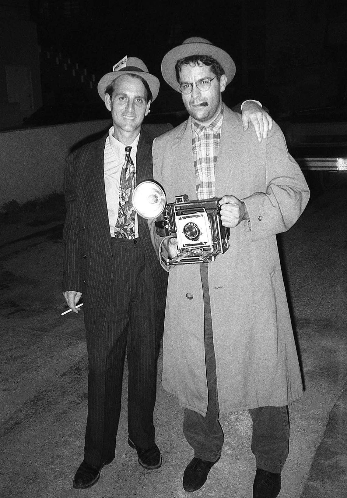 Writer Tom Austin (l) and photographer Steven Hlavac (r), in costumes on Halloween out working for Austin’s social column “Swelter” for newspaper Miami New Times, Miami Beach, Florida, in 1992. “The idea for the costumes - two vintage intrepid newspaper reporters: a writer and a photographer - was [Hlavac’s] and everyone we ran into that night loved the outfits. As you can imagine we made a good team,” Hlavac said of this image. Hlavac was the photographer for Austin’s Swelter column from roughly 1990 to 1995.