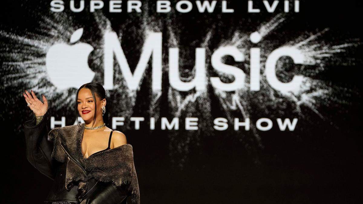 Rihanna poses for a photo after a halftime show news conference ahead of the Super Bowl 57 NFL football game, Thursday, Feb. 9, 2023, in Phoenix. (AP Photo/Mike Stewart)