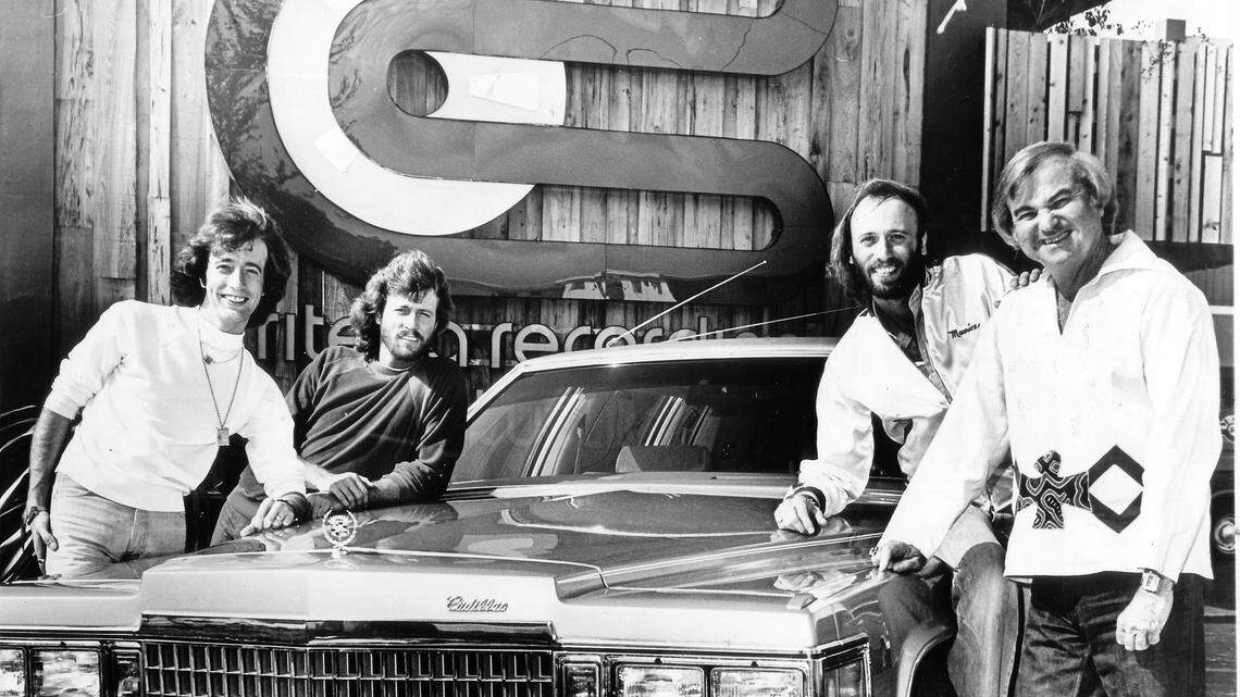 The Bee Gees stand outside Criteria Studios in North Miami in 1978 with a platinum Cadillac they got as a gift from producer Robert Stigwood. From left: Robin, Barry and Maurice Gibb, and Criteria owner Mack Emerman. The Bee Gees were recording what would become their 1979 album, “Spirits Having Flown” album at the studio. That album would hit No. 1 and issue three consecutive No. 1 singles starting with “Too Much Heaven” in 1978 and followed by “Tragedy” and “Love You Inside Out” in 1979. Engineer Dennis Hetzendorfer, who assisted in the recording of that album at Criteria, has called the latter song his favorite Bee Gees production.