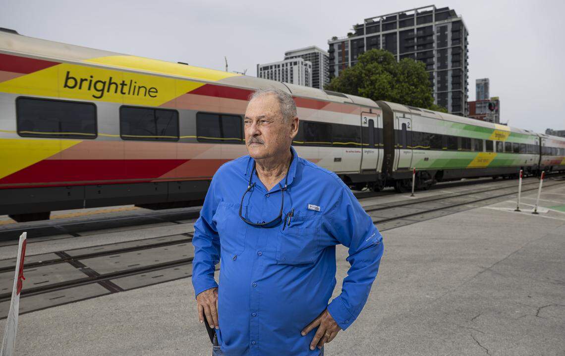 Mike Arias, a train safety advocate, is photographed as a Brightline train makes its way through a crossing at North Miami Avenue and Northwest 19th Street in Miami. “There’s been no accountability on their safety record at all,” Arias said.
