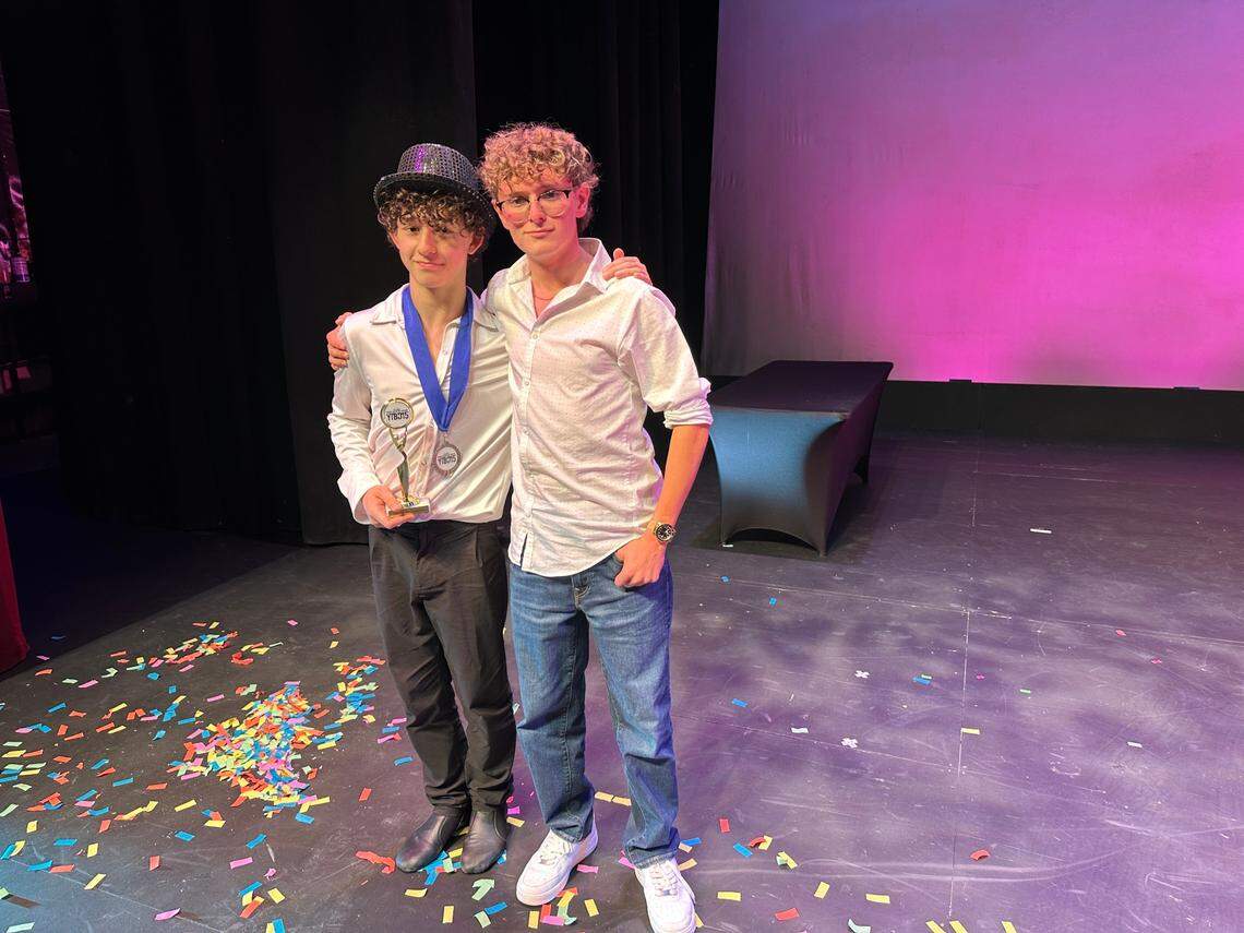 The 2024 Young Talent Big Dreams overall champion Gerry Ibarra, 17, (right), congratulates 2025 overall champ Tamerlan Guliyev, 14, left, on stage at Actors’ Playhouse at the Miracle Theatre after all of the winners were announced on May 10, 2025.