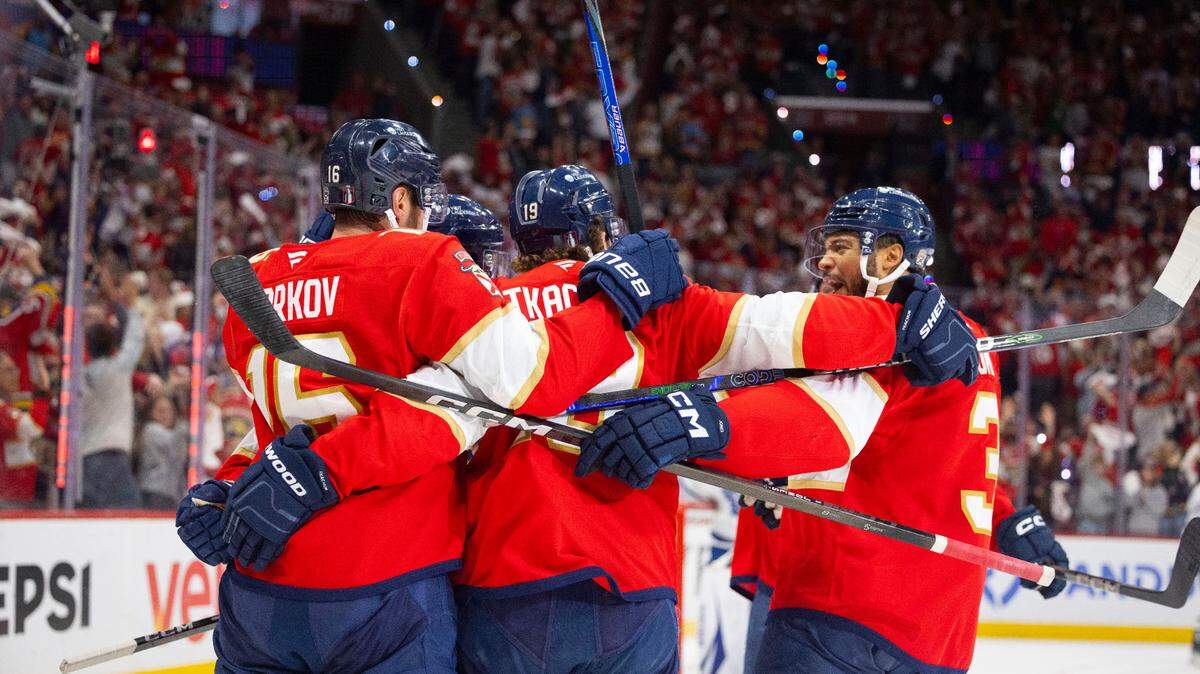 Florida Panthers defenseman Seth Jones (3) yells as he skates into the huddle celebrating a goal by Florida Panthers center Carter Verhaeghe (23) during the first period of Game 4 of a Stanley Cup playoffs second-round series on Sunday, May 11, 2025, at Amerant Bank Arena in Sunrise, Fla.