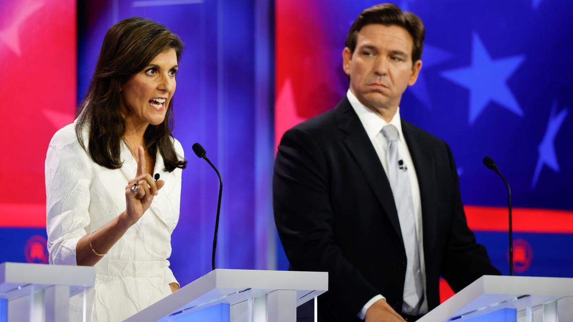 Former U.N. Ambassador Nikki Haley speaks as Florida Gov. Ron DeSantis listens during the third Republican presidential primary debate at the Adrienne Arsht Center for the Performing Arts of Miami-Dade County on Nov. 8.