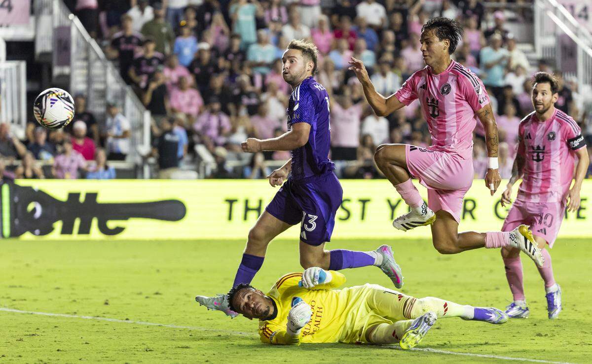 Inter Miami midfielder Telasco Segovia (8) scores a goal against Orlando City goalkeeper Pedro Gallese (1) in the second half of their Leagues Cup semi-final soccer match at Chase Stadium on Wednesday, Aug. 27, 2025, in Fort Lauderdale, Fla.