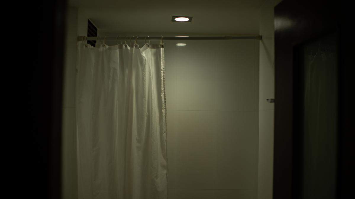 You already shower at night. Dimming the lights before bed could help you fall asleep faster and it costs nothing to try.