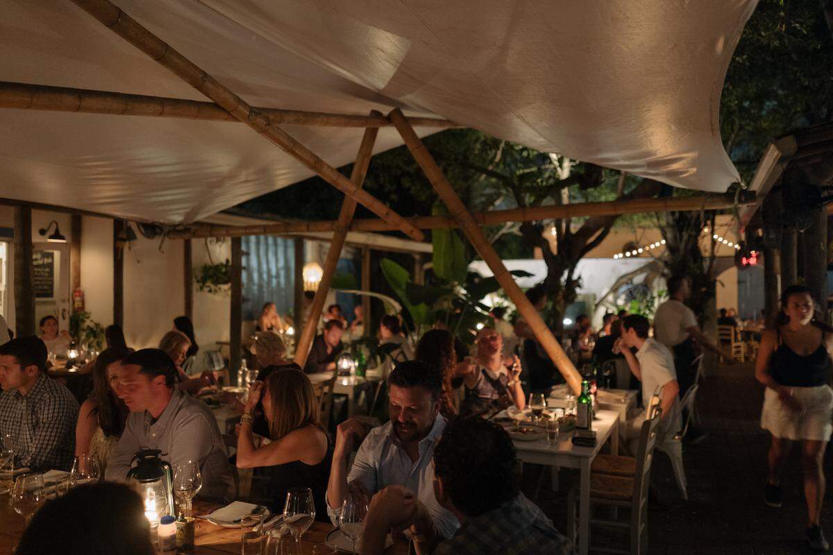 Mandolin Aegean Bistro, which has extensive outdoor seating,  has added fans, foliage and awnings to help deal with the rising heat. The serving staff is even now allowed to wear shorts when temperatures call for it. 