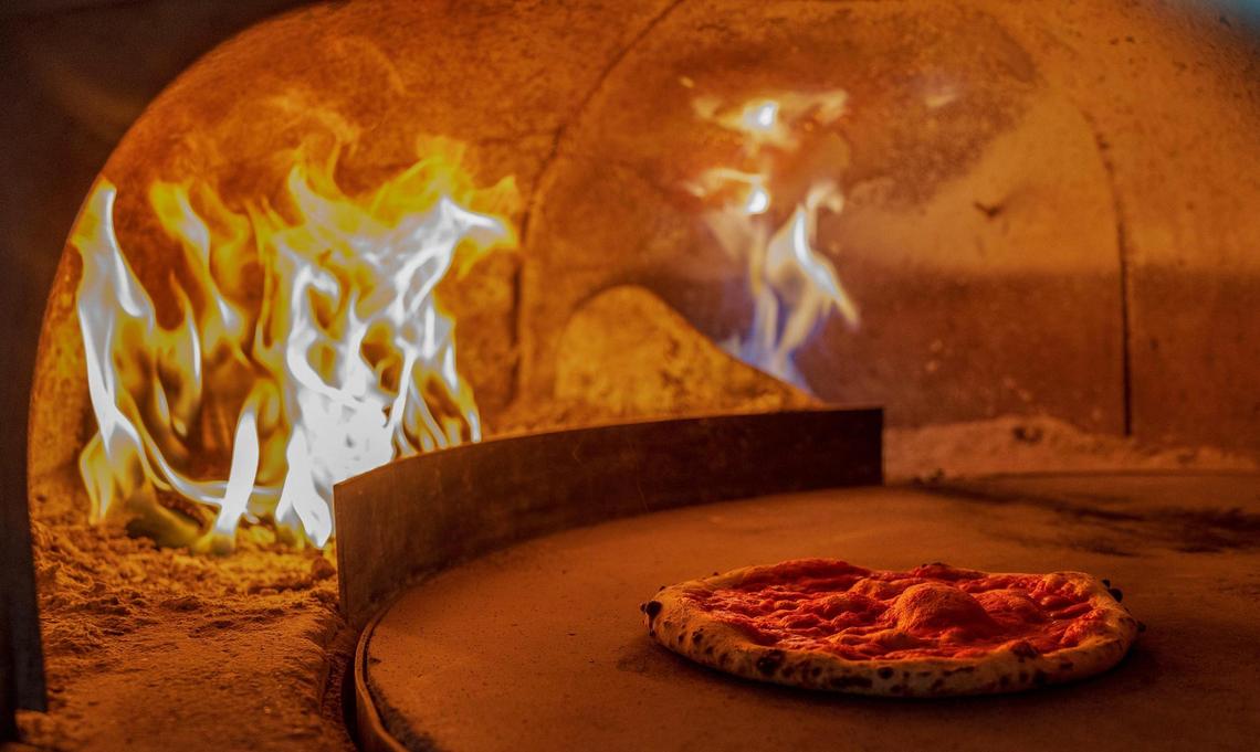 The pizza at La Natural is cooked in a wood-fired oven.