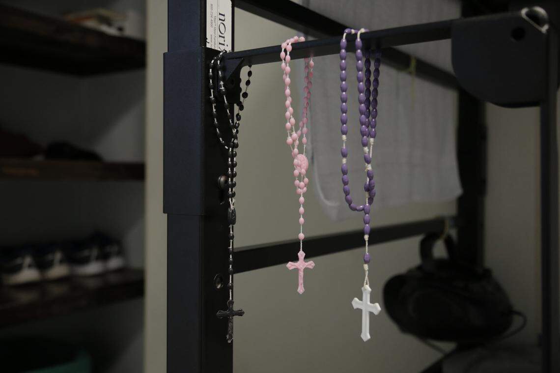 Rosaries hang in a bedroom at Catholic Charities’ Msgr. Bryan Walsh Children’s Village in Cutler Bay. The center houses abut 80 children, including babies and toddlers, who have come to the United States from Central America as undocumented minors.