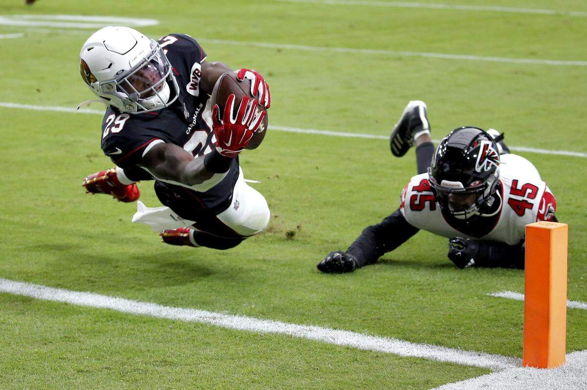 Arizona Cardinals running back Chase Edmonds (29) scores a touchdown as Atlanta Falcons linebacker Deion Jones (45) defends during the first half of an NFL football game, Sunday, Oct. 13, 2019, in Glendale, Ariz. The Dolphins reached an agreement with running back Chase Edmonds on a two-year, $12.6 million deal Monday.